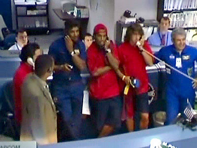  - FC_Barcelona_coach_Rijkaard_and_players_Xavi_Puyol_and_Ronaldinho_make_a_phone_call_to_the_ISS_Expedition_13_crew_node_full_image