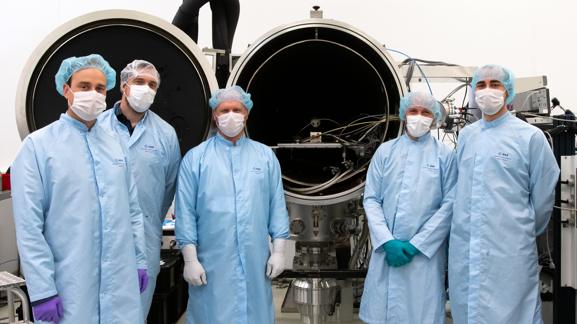 LaRa team beside thermal vacuum chamber