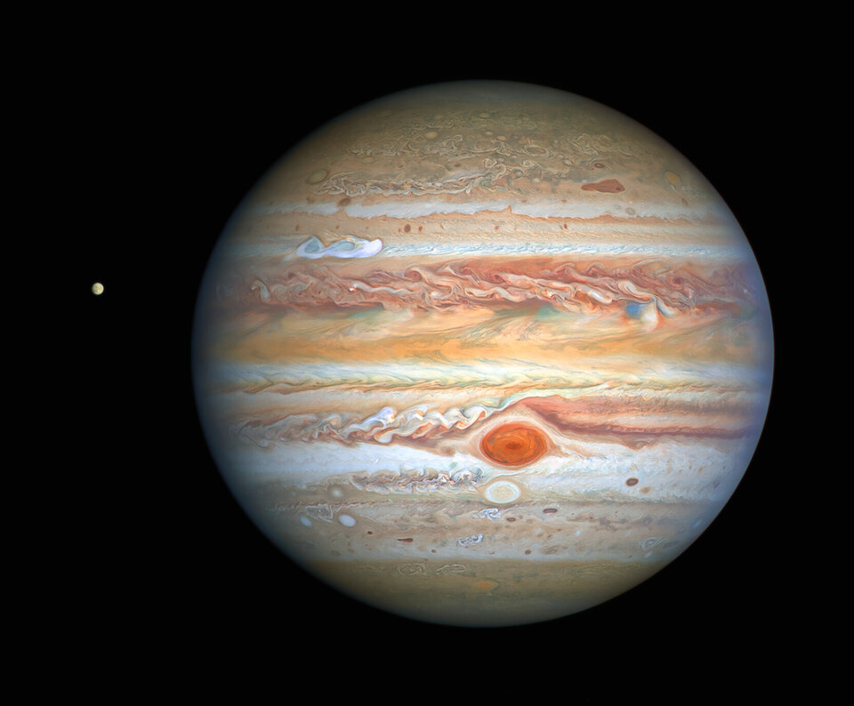 Hubble image of Jupiter with Europa. The Great Red Spot and smaller Oval BA are visible.