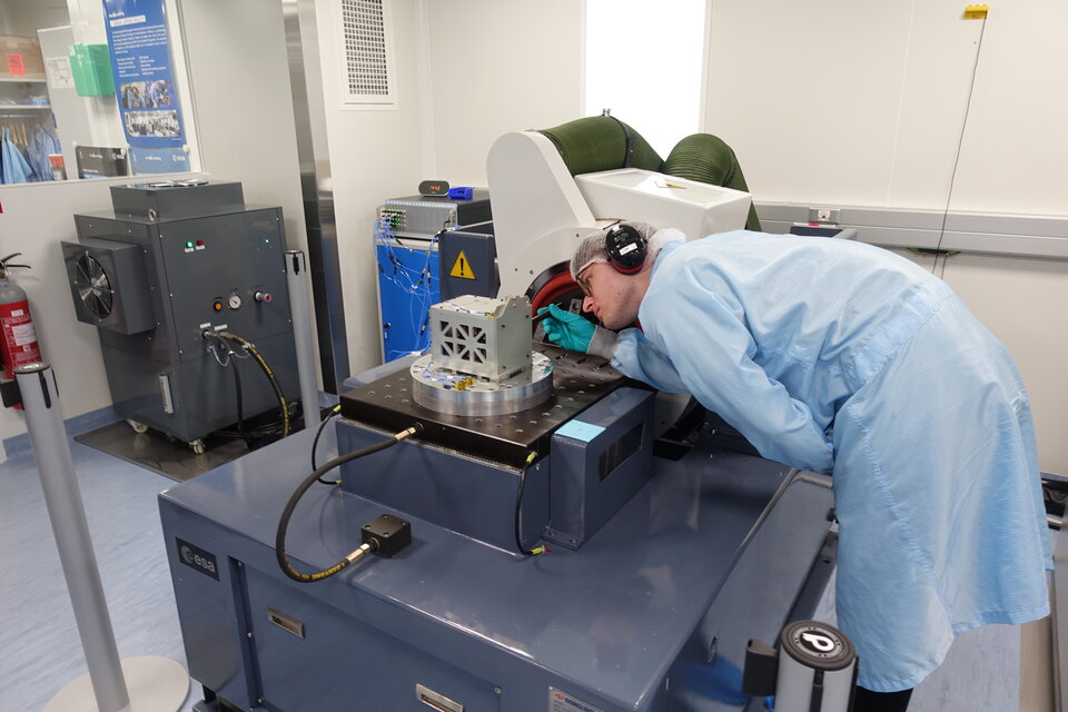 A student performing a visual inspection  after the vibration test