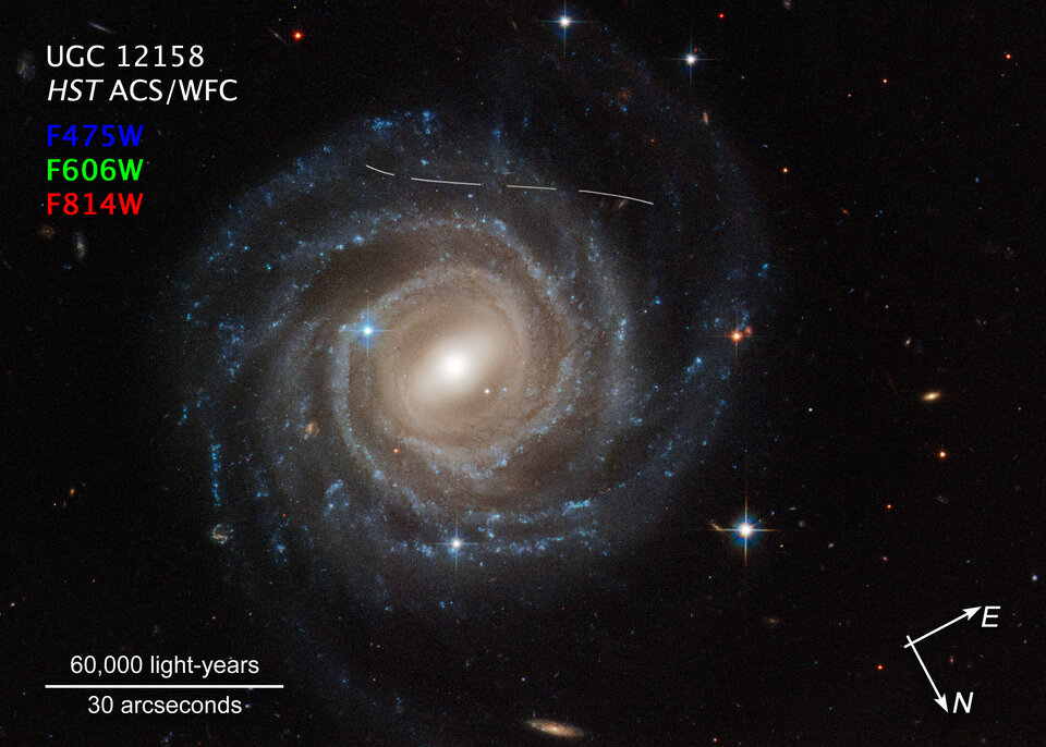Asteroid photobombs Hubble snapshot of Galaxy UGC 12158 (compass image)