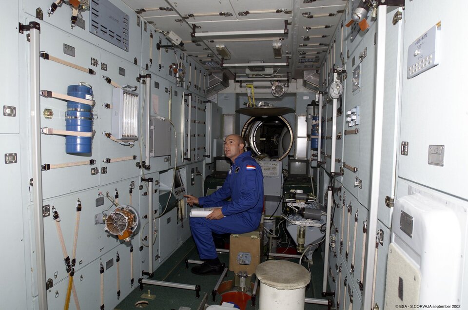 André Kuipers trains inside a full-sized ISS model