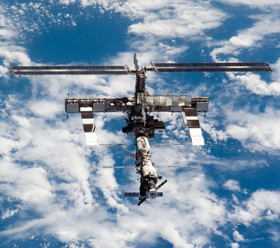 The P6 solar arrays (top of ISS) are shown fully extended