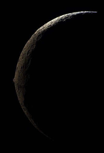 Slim crescent of Iapetus looms