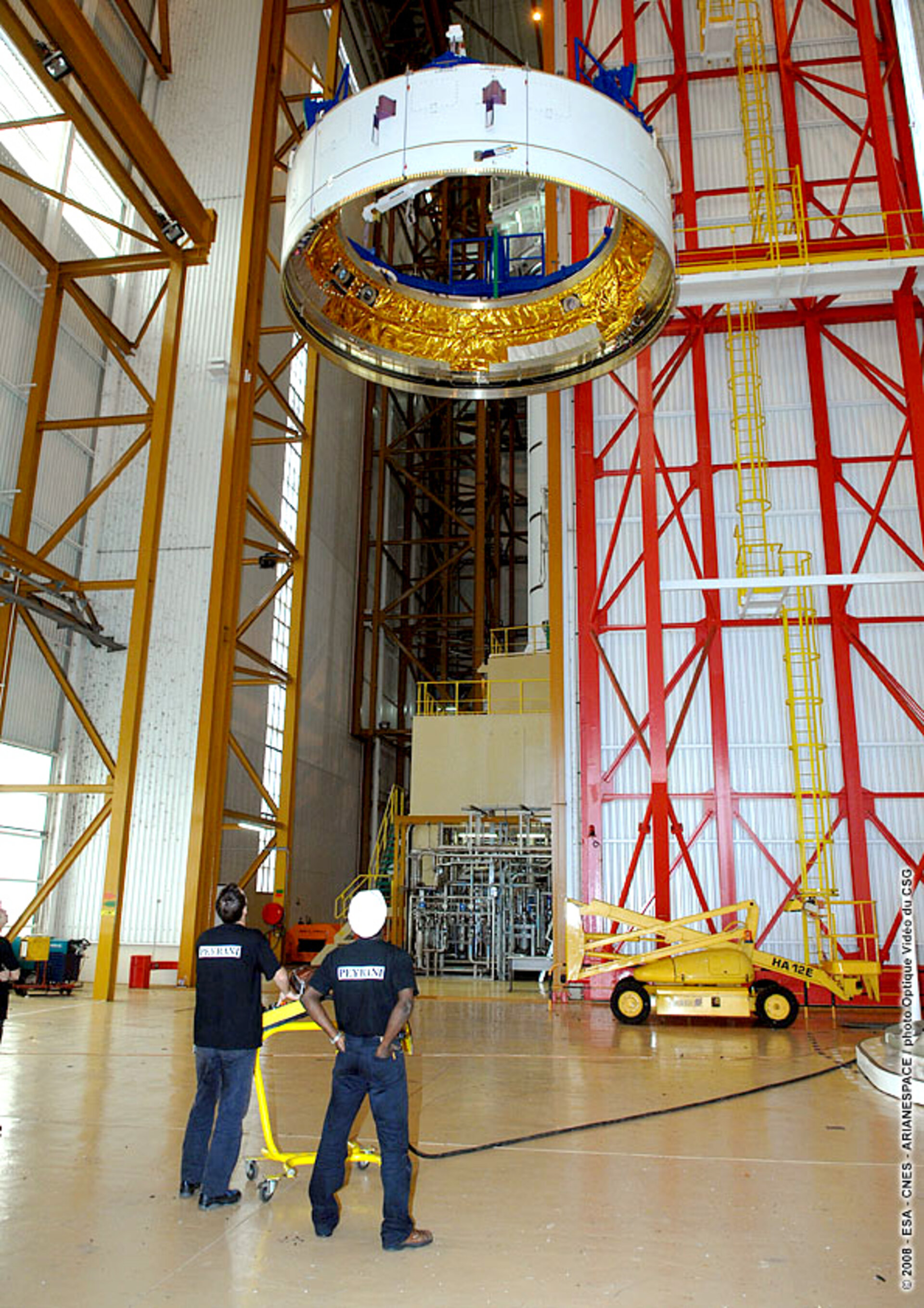 Engineers at Europe's Spaceport in Kourou, French Guiana, prepare the Ariane 5 ES ATV for the Jules Verne flight