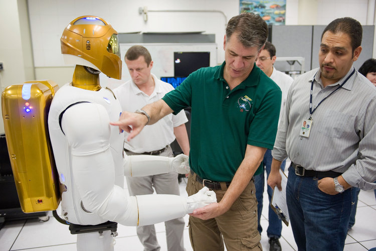 Paolo Nespoli with a Robonaut