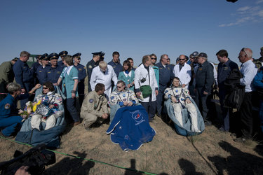 Cathenine, Dmitri and Paolo resting after landing