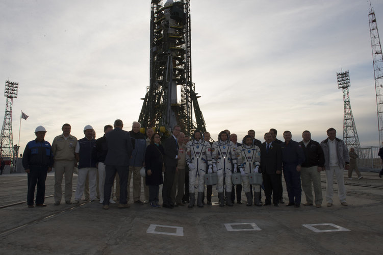 Soyuz TMA-18M crew members and dignitaries at the launch pad