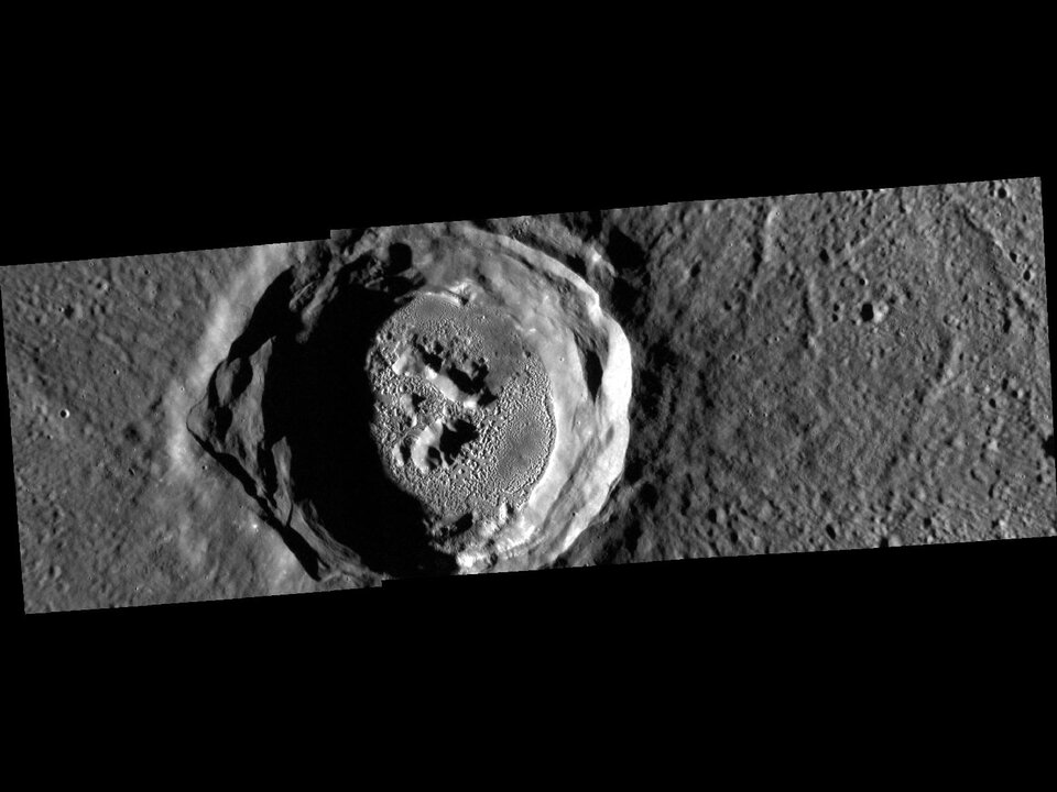 Small dents, or hollows, in the Kertész crater of Mercury. These previously unknown geological features were discovered by NASA’s MESSENGER mission and their origin remains a mystery