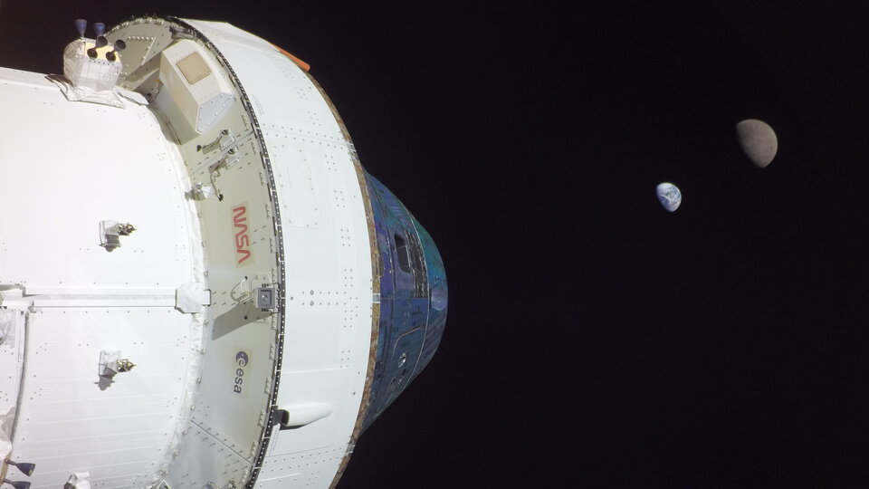 View of Earth, the Moon and the European Service Module powering Orion during Artemis I